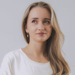 model wearing sand + salt jewelry; gold-filled, gemstone, and freshwater pearl jewelry