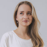 model wearing sand + salt jewelry; gold-filled, gemstone, and freshwater pearl jewelry