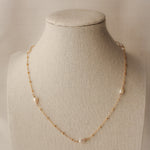 sand + salt pearlfect necklace on jewelry display bust, gold-filled and freshwater pearl necklace