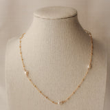 sand + salt pearlfect necklace on jewelry display bust, gold-filled and freshwater pearl necklace