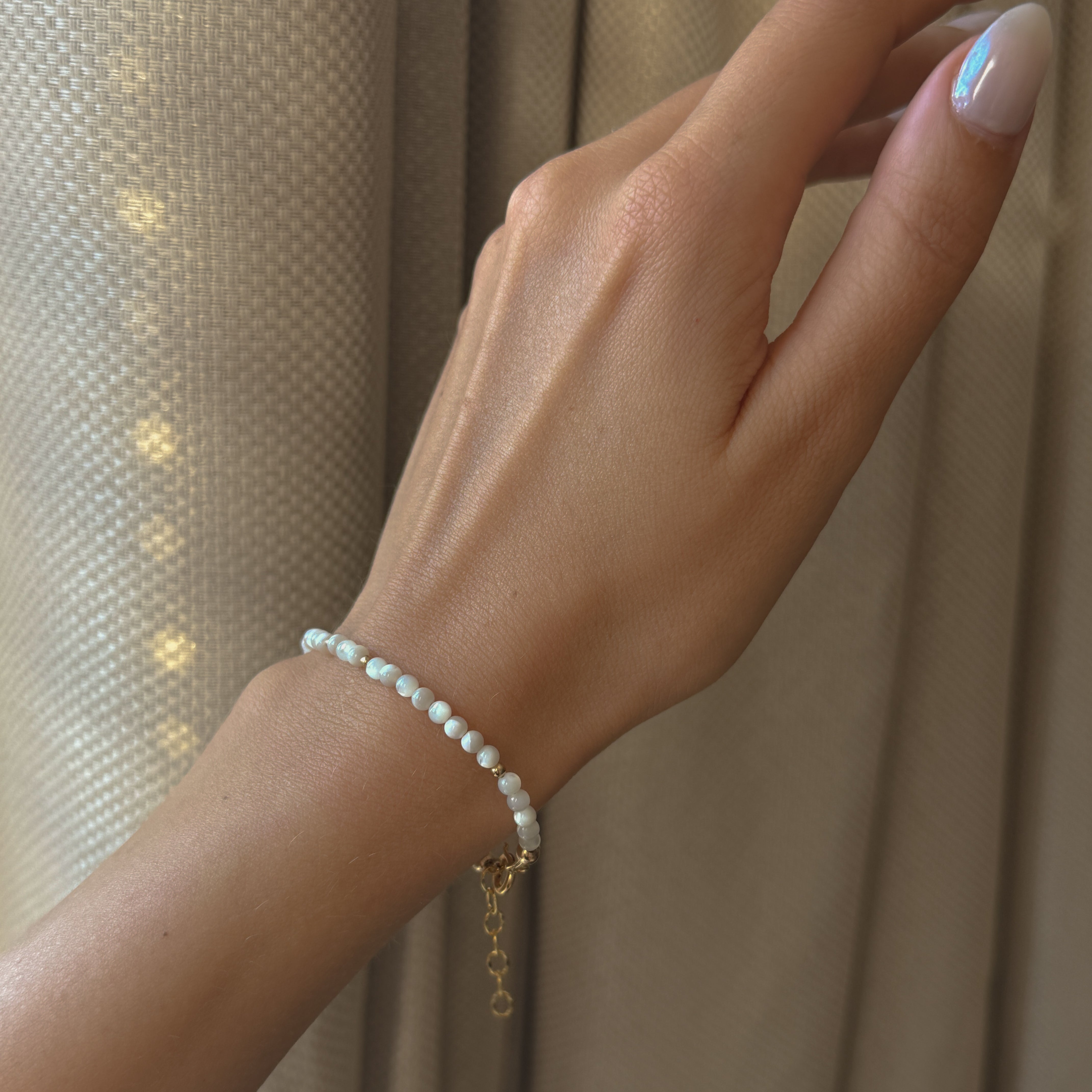 Sand + Salt bracelets / Sand and Salt Studio gemstone bracelets close-up on a woman's wrist / handmade jewelry / Sand + Salt Studio 14k Gold-Fill & Gemstone
