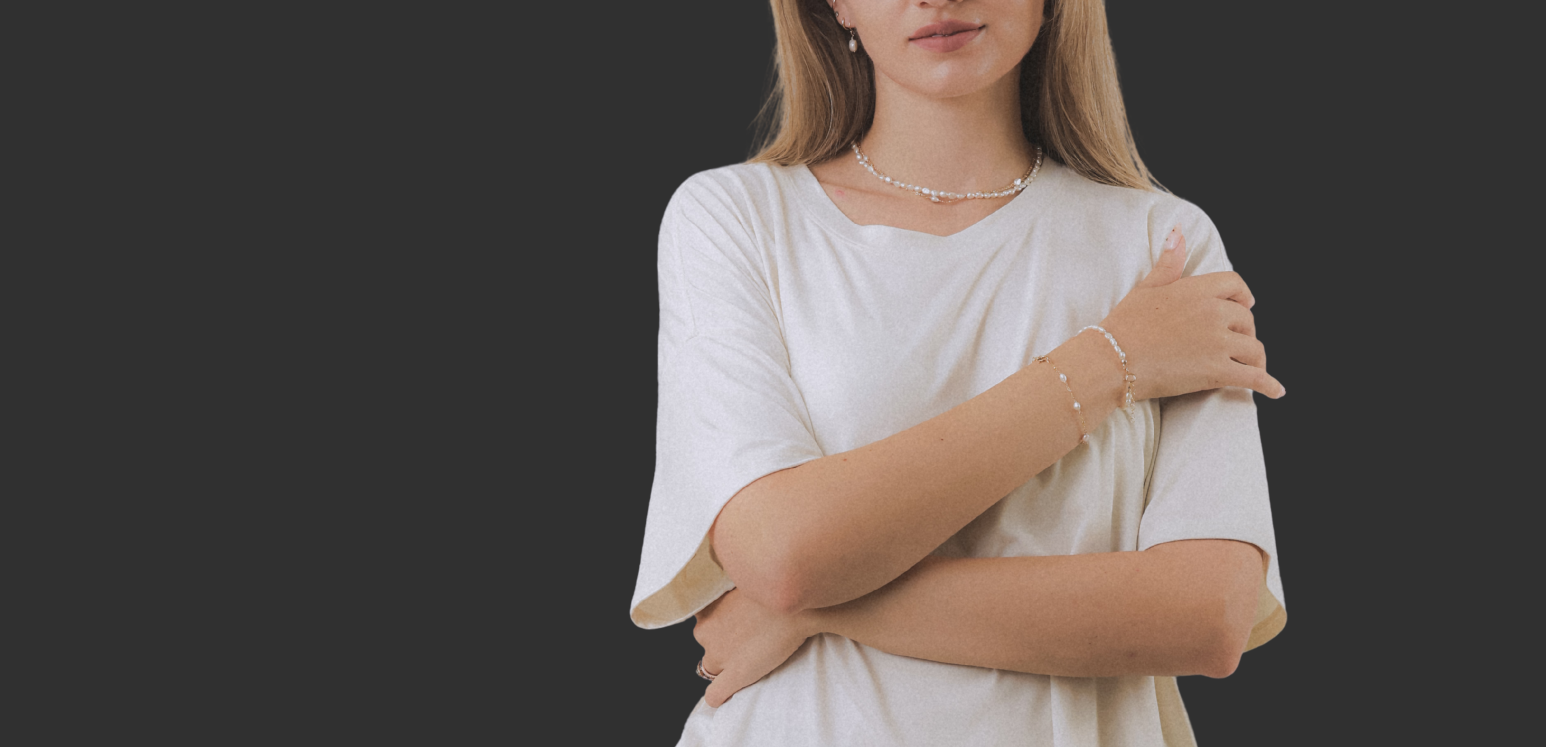 Woman wearing a white dress with a plain background