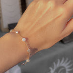 pearlfect bracelet modeled on wrist; sand + salt gold filled and freshwater pearl jewelry